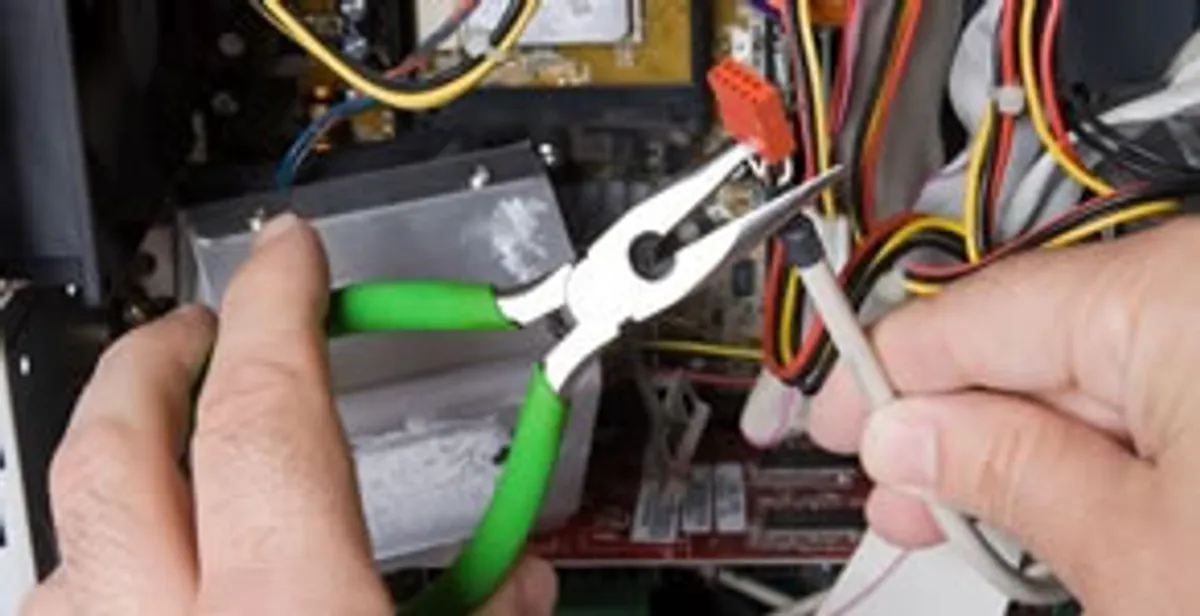 Licensed electrical contractor performing electrical repair with tools in Amado, AZ